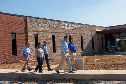 group of people touring construction of the Grain and Forage Center of Excellence at the University of Kentucky Research and Education Center at Princeton.
