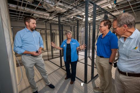 group of people touring construction of the Grain and Forage Center of Excellence at the University of Kentucky Research and Education Center at Princeton.