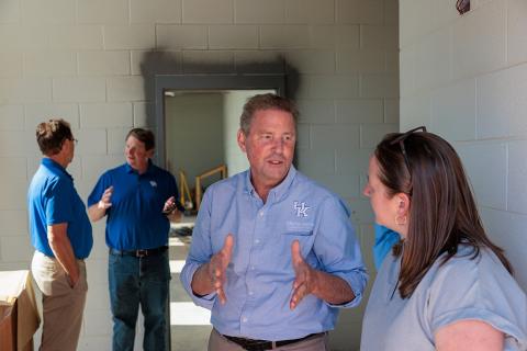 group of people touring construction of the Grain and Forage Center of Excellence at the University of Kentucky Research and Education Center at Princeton.