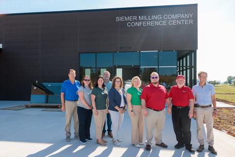 group of people touring construction of the Grain and Forage Center of Excellence at the University of Kentucky Research and Education Center at Princeton.